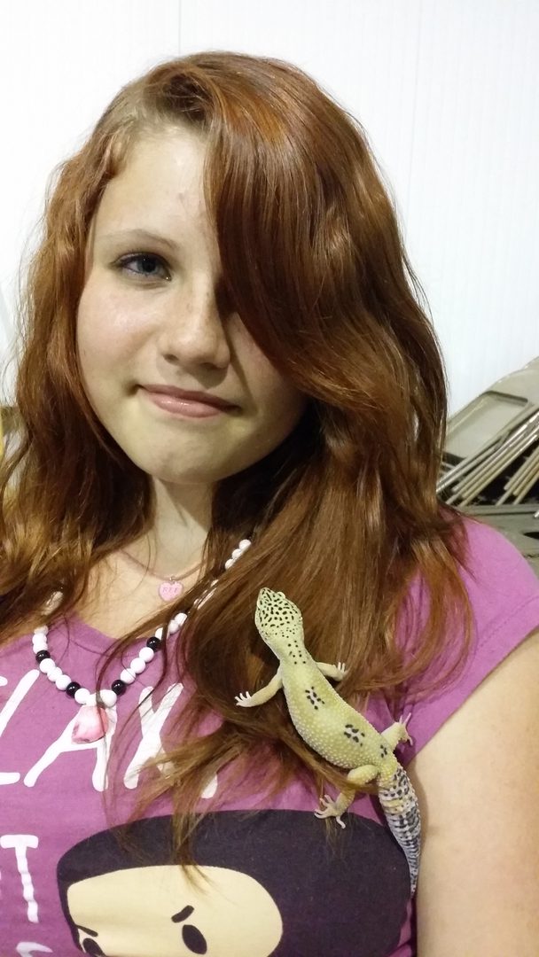Girl with a pet lizard