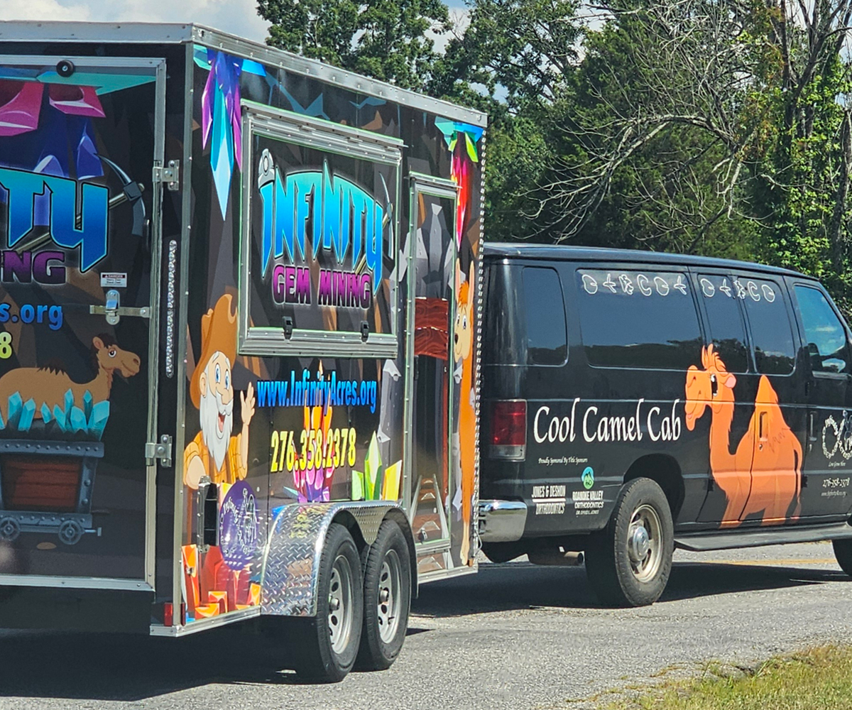 Cool Camel Cab parked beside trailer
