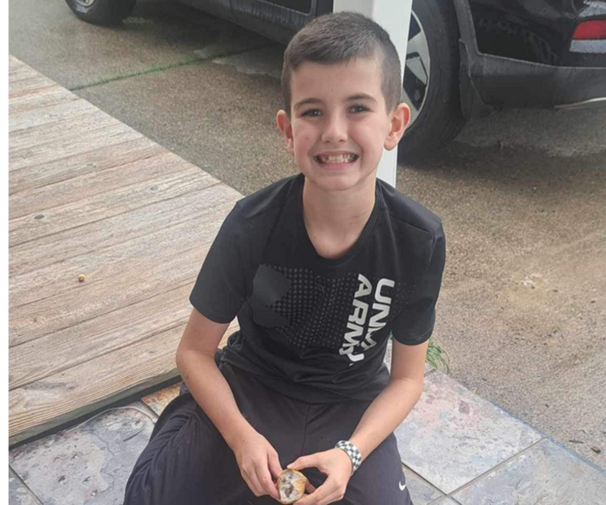 Young boy enjoying outdoor snack time